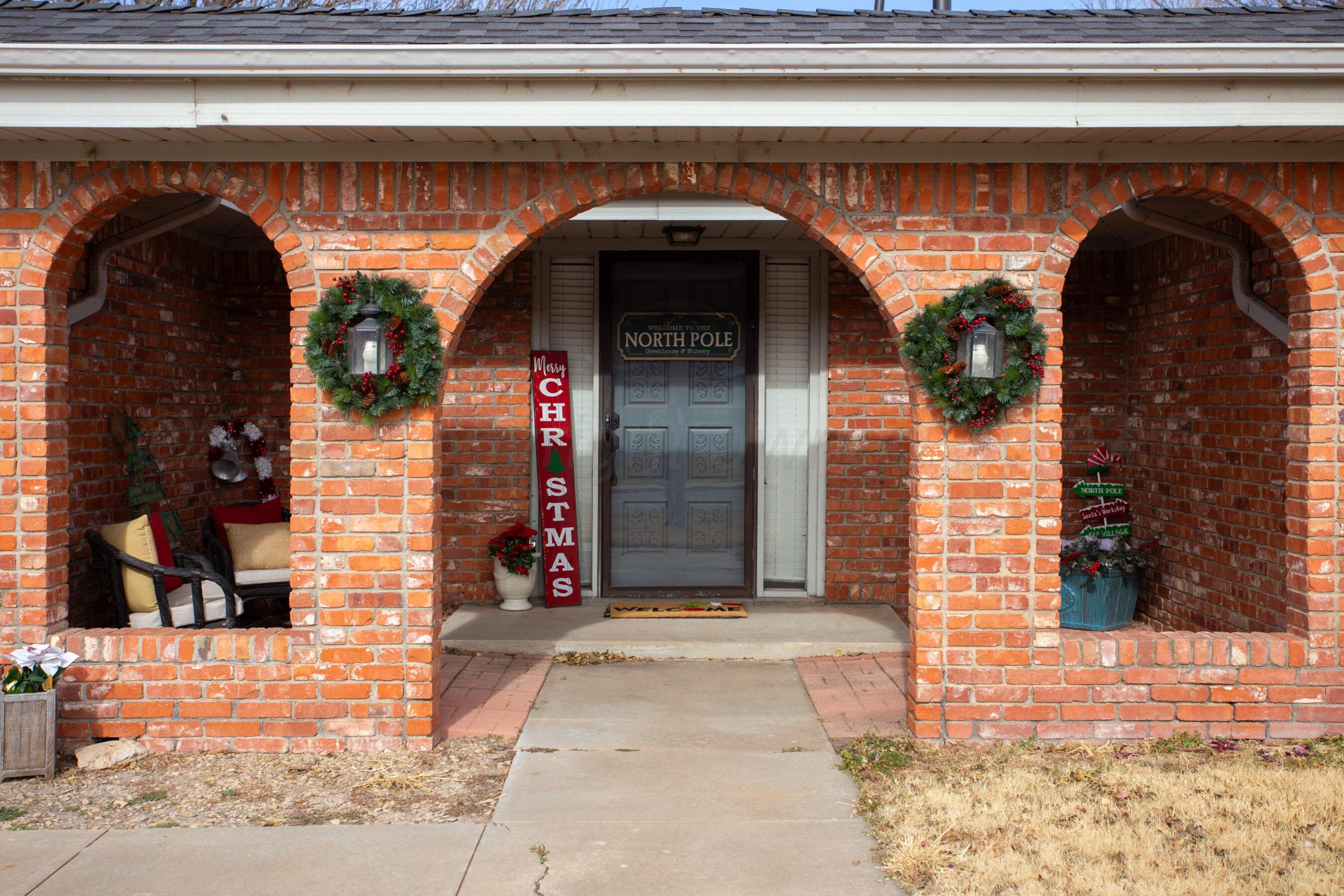 2907 Mable Drive Canyon, TX 79015 - Photo 2 of 23 a view of entrance gate of the house and cars