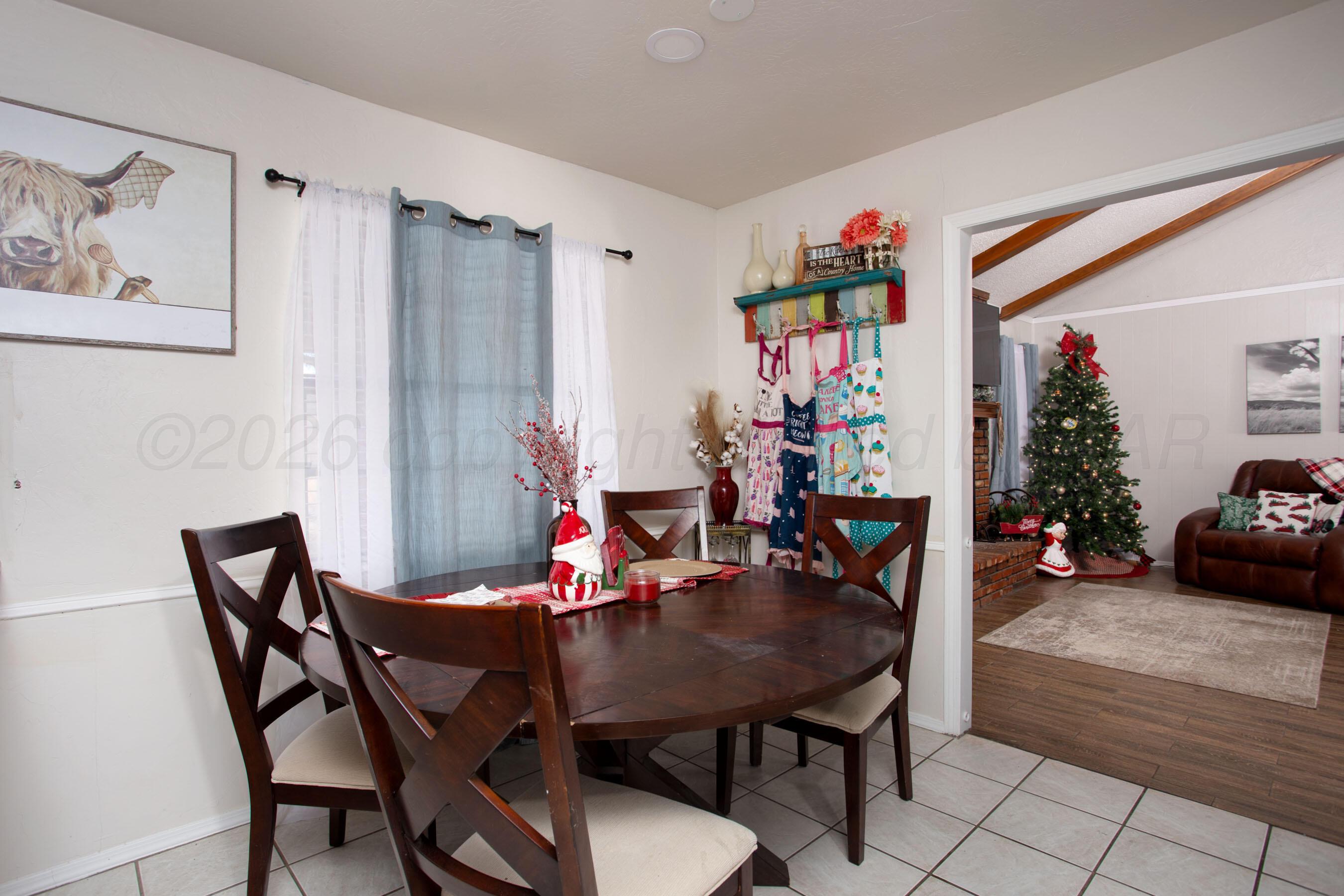 2907 Mable Drive Canyon, TX 79015 - Photo 8 of 23 a view of a dining room with furniture and wooden floor