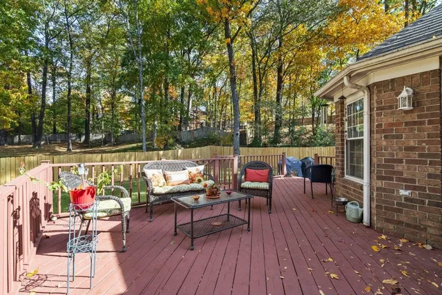 a view of a backyard with a garden and trees