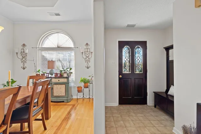 a view of a livingroom with furniture window and wooden floor
