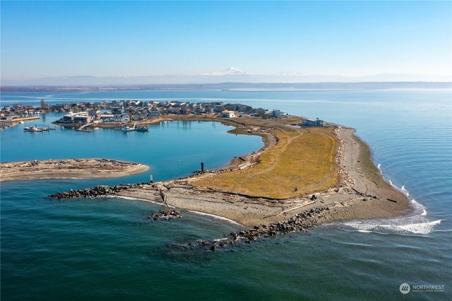an aerial view of a house with a lake view