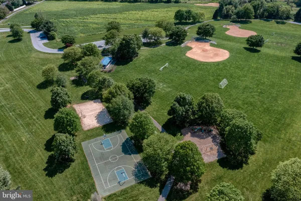 an aerial view of a house with outdoor space and street view