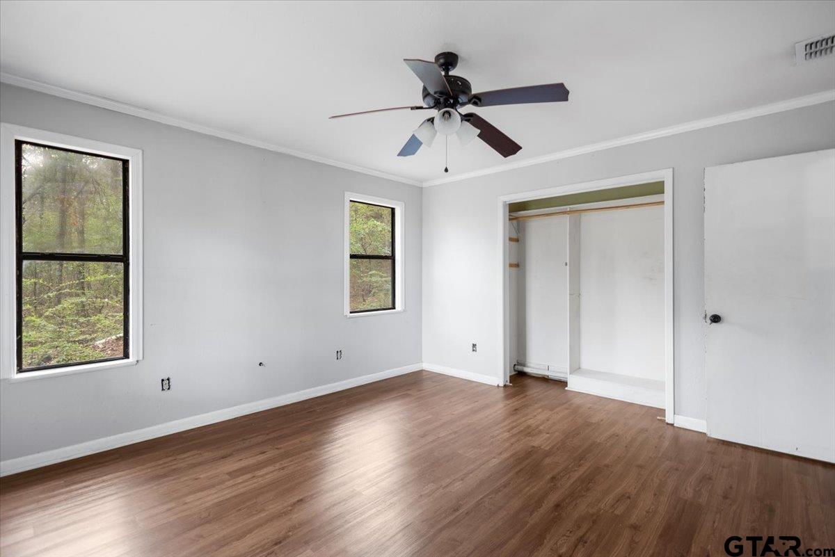 13546 FM 3271 Tyler, TX 75704 - Photo 11 of 20 a view of an empty room with wooden floor and a window