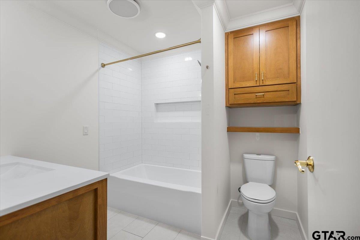 13546 FM 3271 Tyler, TX 75704 - Photo 14 of 20 a bathroom with a sink a toilet and shower