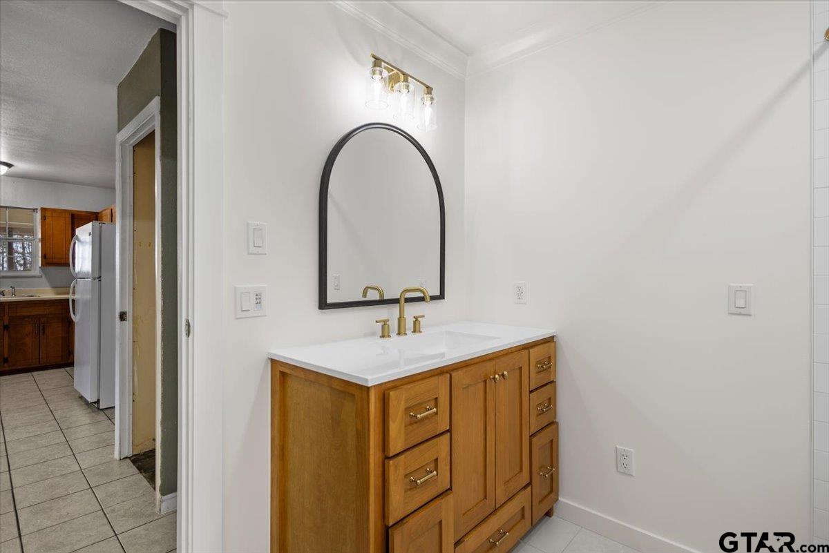 13546 FM 3271 Tyler, TX 75704 - Photo 15 of 20 a bathroom with a sink a vanity and a mirror