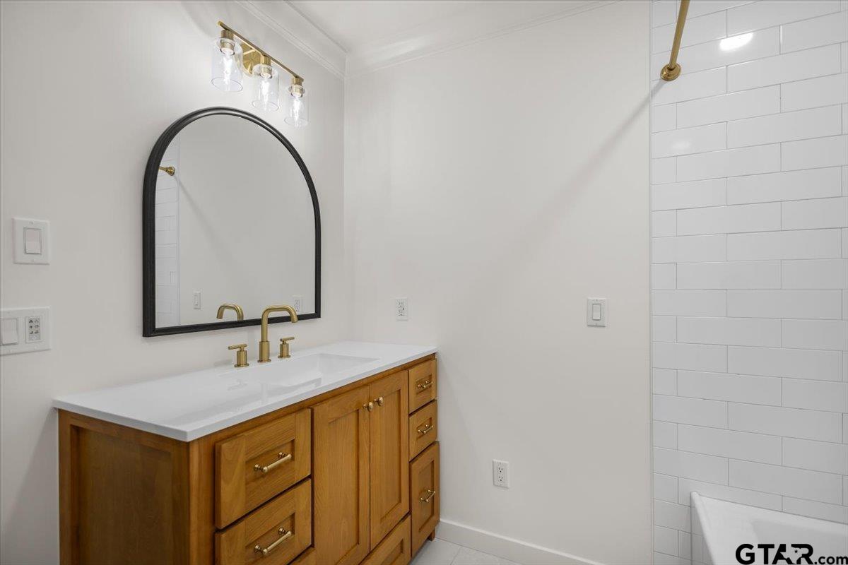 13546 FM 3271 Tyler, TX 75704 - Photo 16 of 20 a bathroom with a sink and a mirror