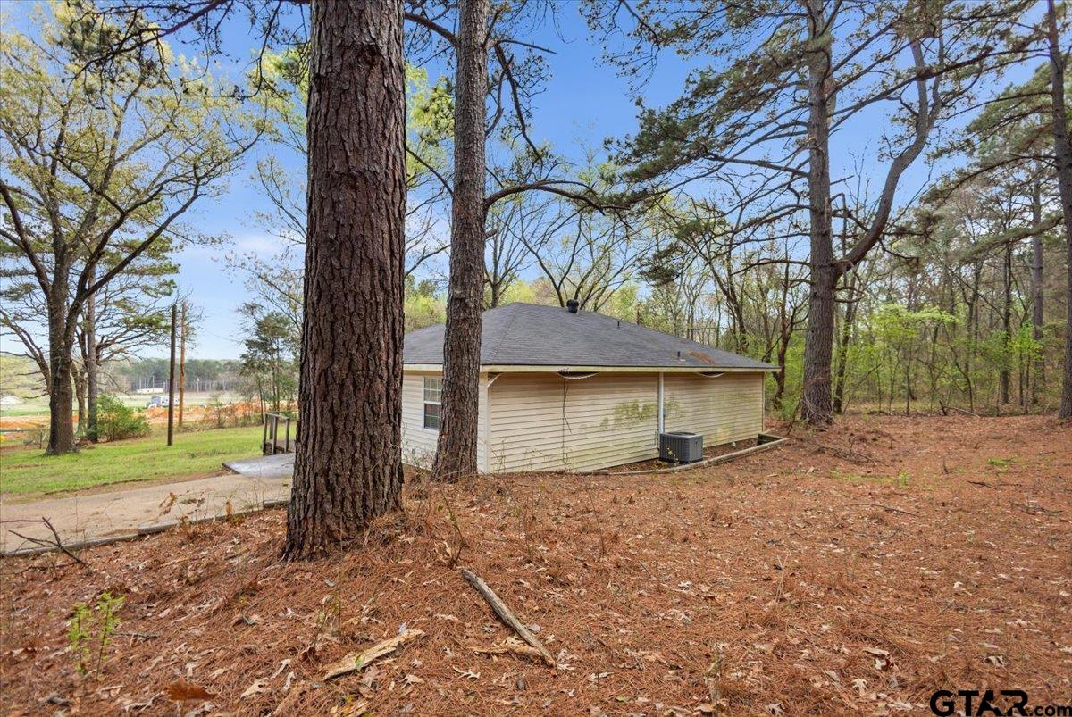13546 FM 3271 Tyler, TX 75704 - Photo 19 of 20 a house with trees in front of it