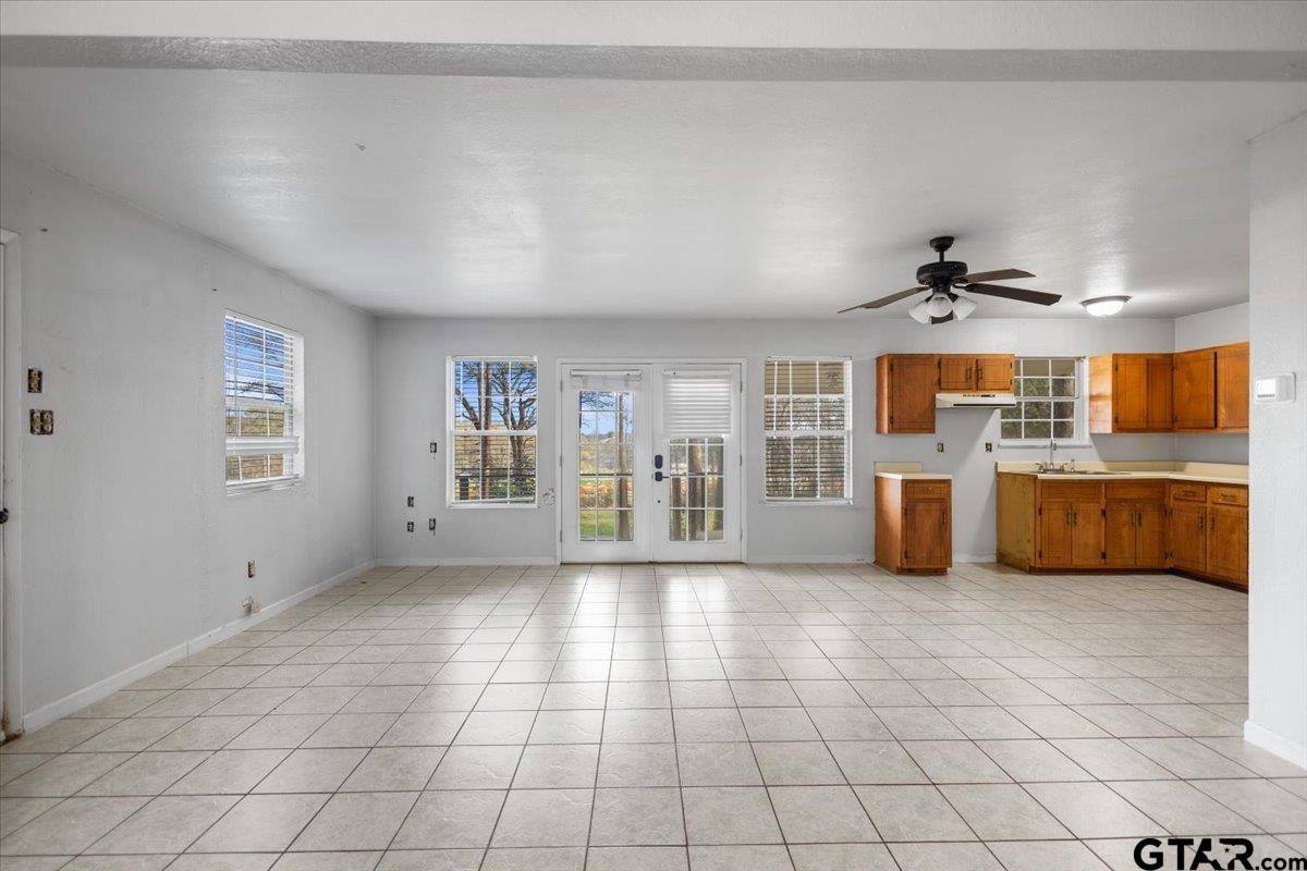 13546 FM 3271 Tyler, TX 75704 - Photo 5 of 20 a view of a kitchen with microwave and cabinets