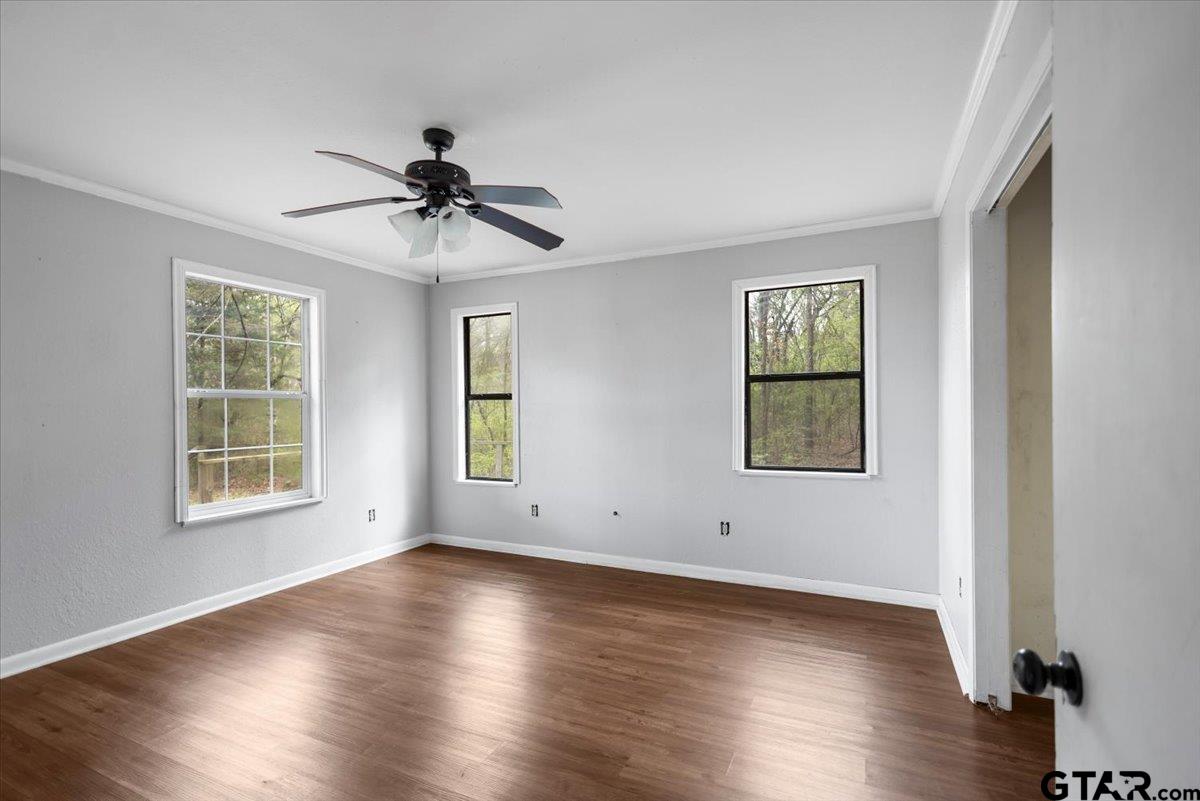 13546 FM 3271 Tyler, TX 75704 - Photo 10 of 20 wooden floor in an empty room with a window