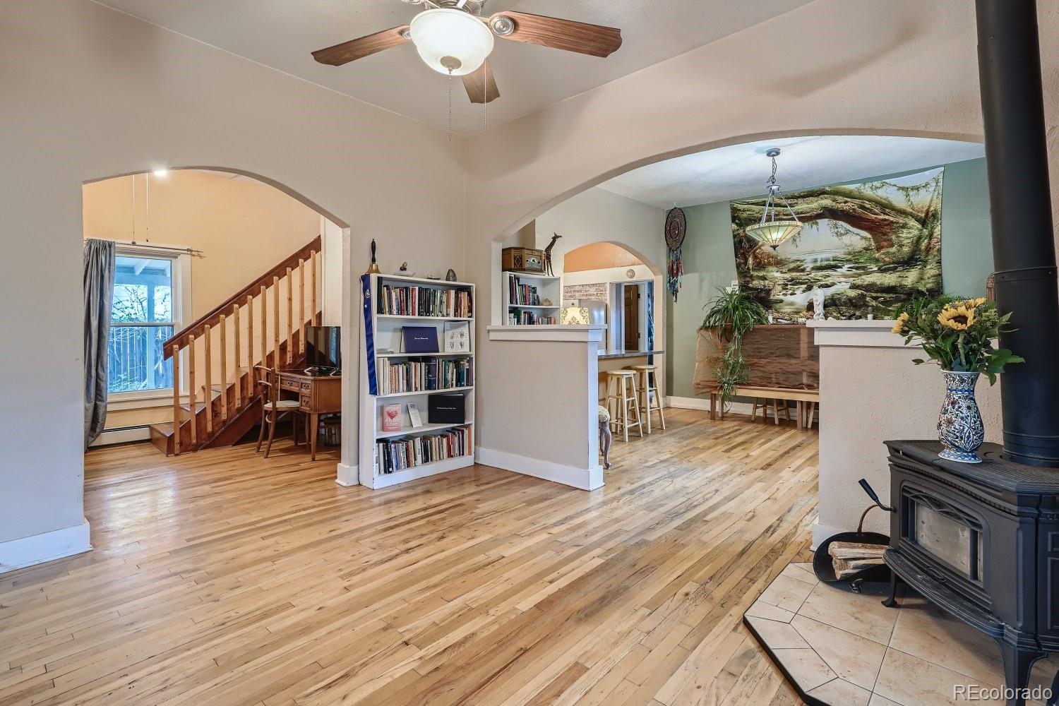 507 West Baseline Road Lafayette, CO 80026 - Photo 3 of 28 a living room with furniture and a wooden floor