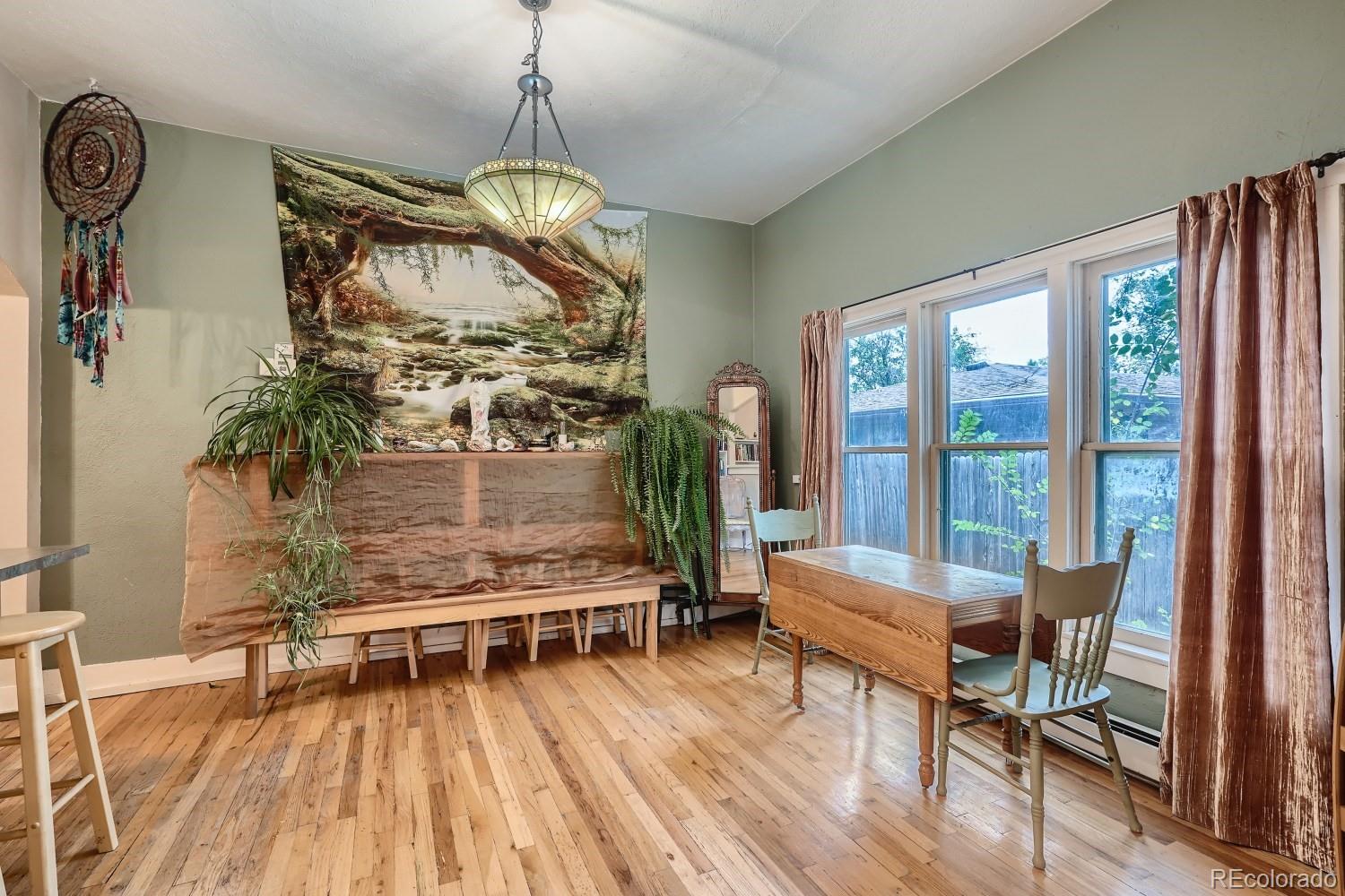 507 West Baseline Road Lafayette, CO 80026 - Photo 8 of 28 a living room with furniture a rug and a floor to ceiling window