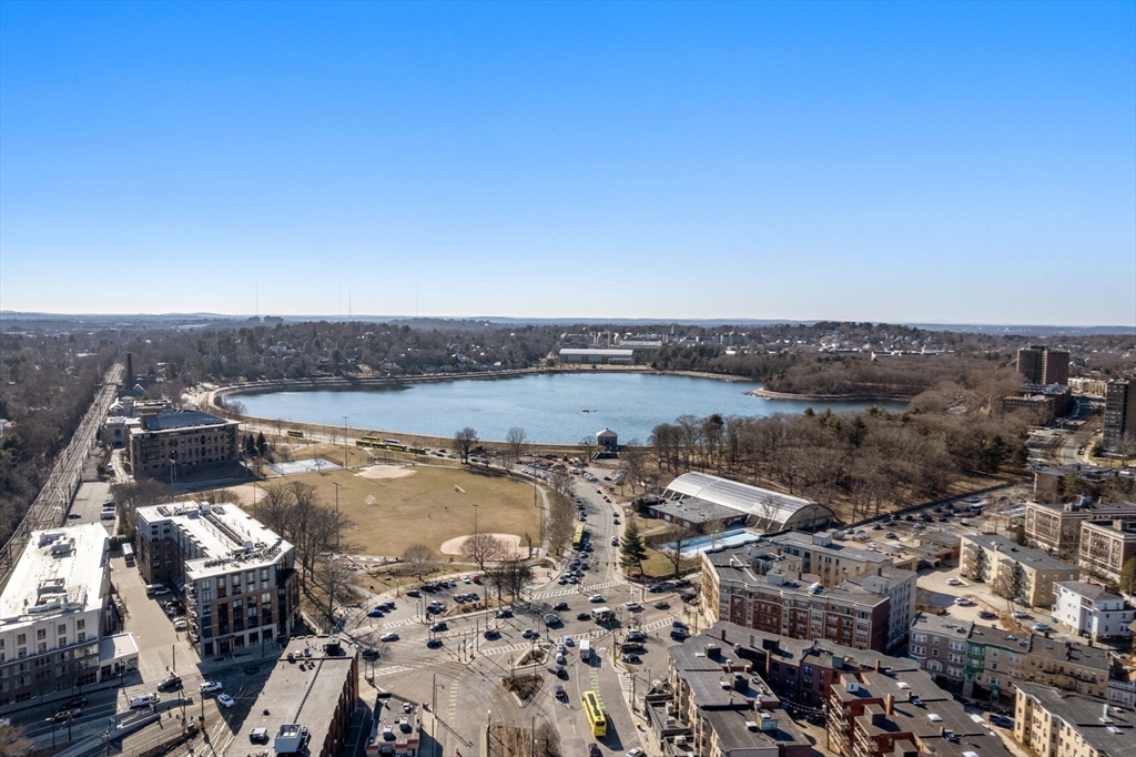 1762 Beacon Street, Unit 1 Brookline, MA 02445 - Photo 15 of 17 an aerial view of a house with a lake view
