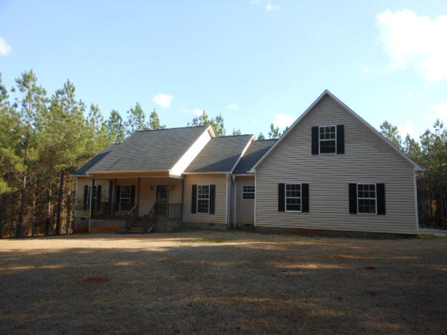 173 Gordon Road Gray, GA 31032 - Photo 1 of 18 a front view of a house with a yard