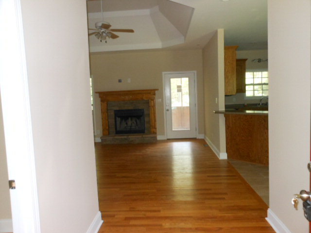 173 Gordon Road Gray, GA 31032 - Photo 2 of 18 a view of an empty room with window and fire place