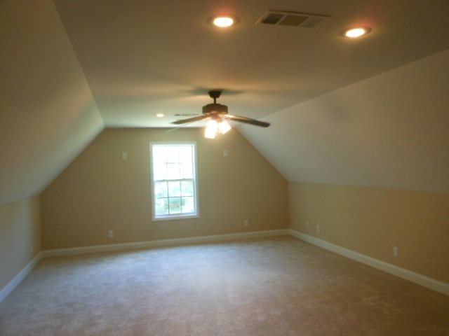 173 Gordon Road Gray, GA 31032 - Photo 14 of 18 an empty room that has a window and a ceiling fan