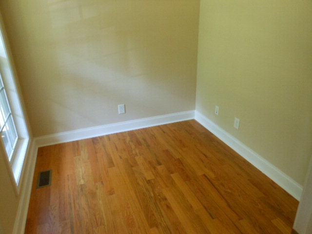 173 Gordon Road Gray, GA 31032 - Photo 18 of 18 a view of an empty room with wooden floor and a window