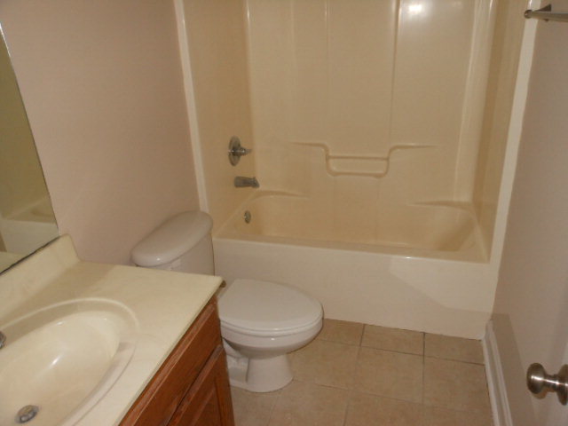 173 Gordon Road Gray, GA 31032 - Photo 6 of 18 a white toilet sitting next to a bath tub