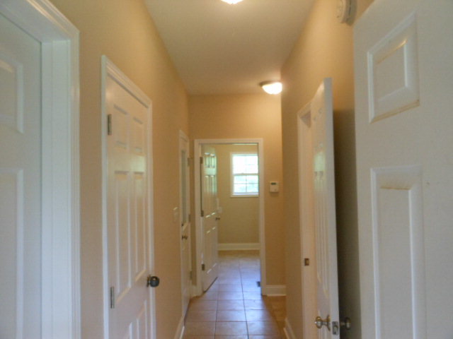 173 Gordon Road Gray, GA 31032 - Photo 9 of 18 a view of a hallway with wooden floor