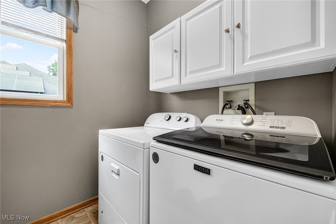 35748 Mills Road Avon, OH 44011 - Photo 19 of 44 Washroom with cabinet space and washing machine and clothes dryer