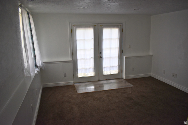 3327 East Windhover Road Eagle Mountain, UT 84005 - Photo 26 of 38 Bright interior space with French doors, recessed lighting, and a window for natural light