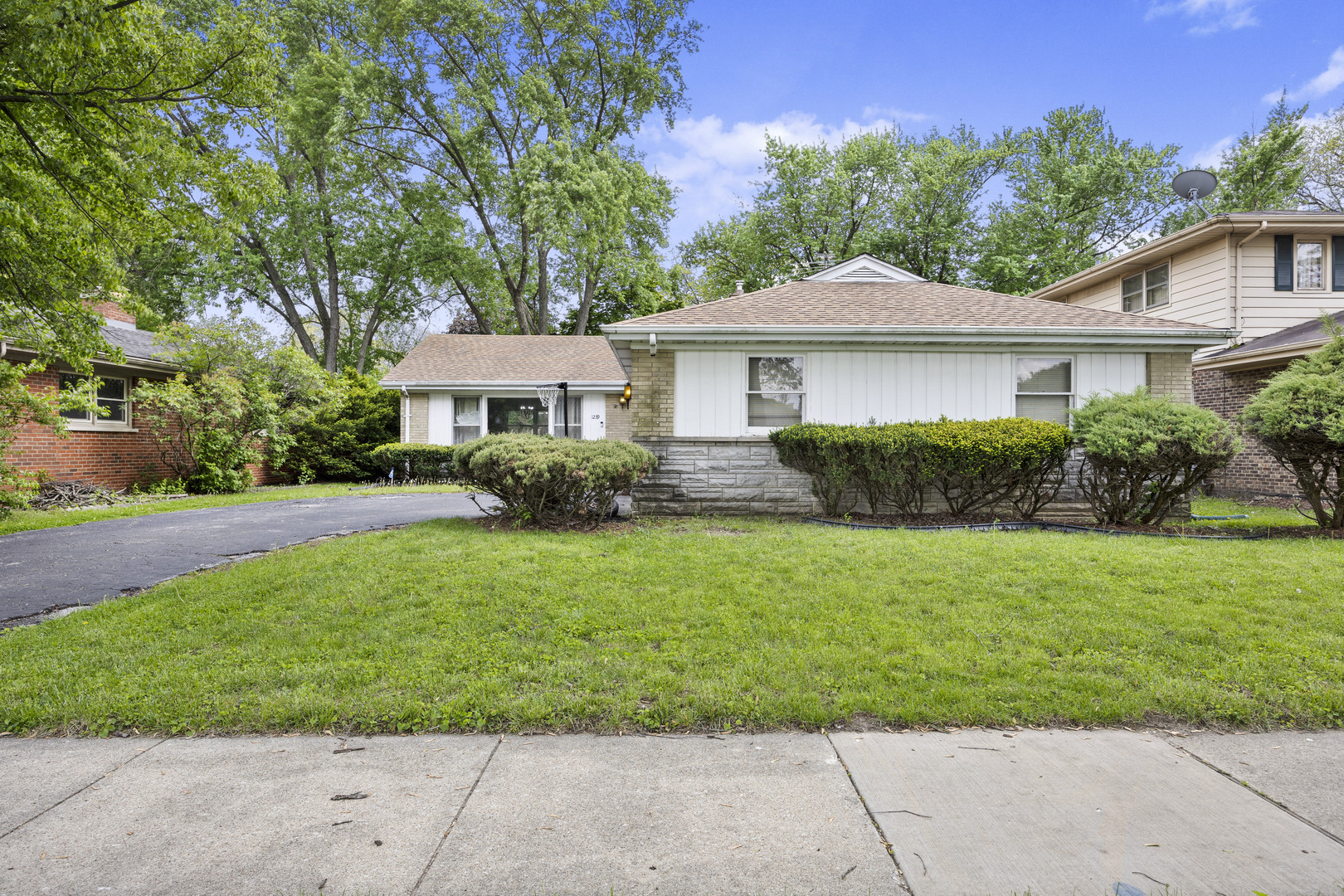 1239 190th Street Homewood, IL 60430 - Photo 2 of 2 a front view of a house with a garden