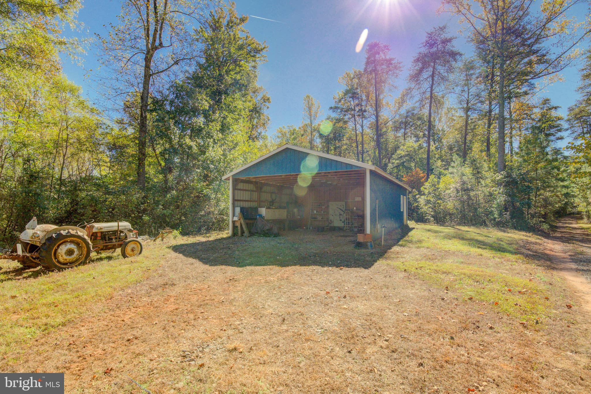 1421 Bohannon Road Bumpass, VA 23024 - Photo 32 of 55 24' x 40'pole barn, 18 ft enclosed w/power & water