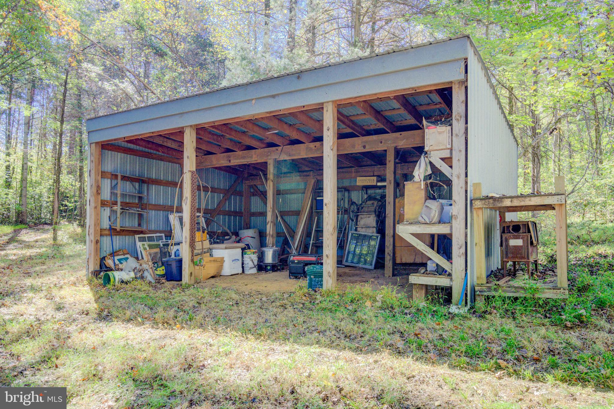 1421 Bohannon Road Bumpass, VA 23024 - Photo 42 of 55 18' x 24' pole barn, adjacent to hunting cabin