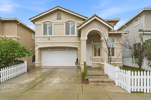 a front view of a house with a garage