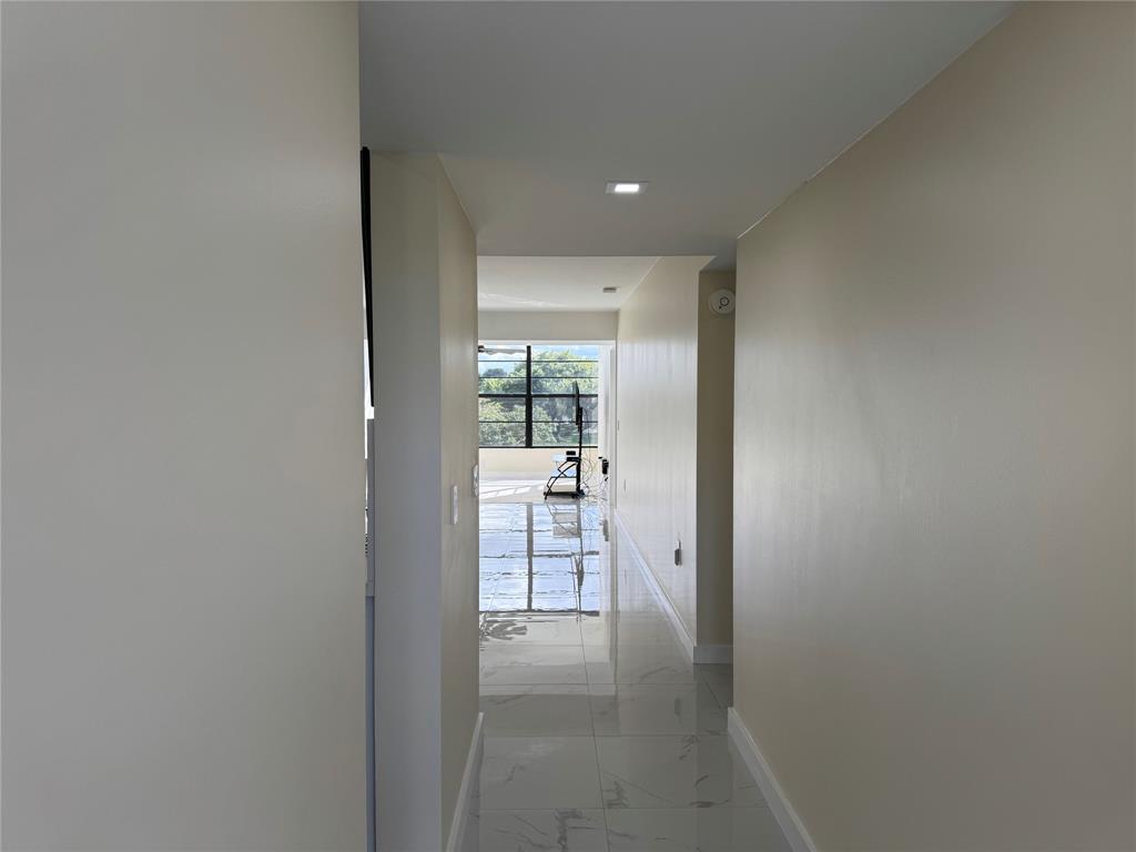 1520 Whitehall Drive, Unit 306 Davie, FL 33324 - Photo 1 of 42 a view of hallway with wooden floor