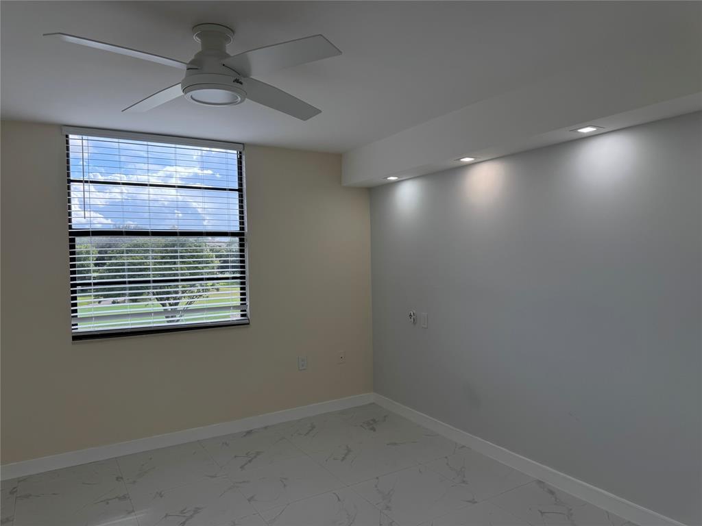 1520 Whitehall Drive, Unit 306 Davie, FL 33324 - Photo 19 of 42 a view of an empty room with a window