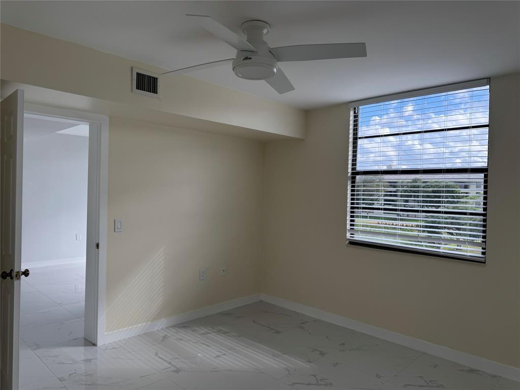 1520 Whitehall Drive, Unit 306 Davie, FL 33324 - Photo 20 of 42 a view of an empty room with a window