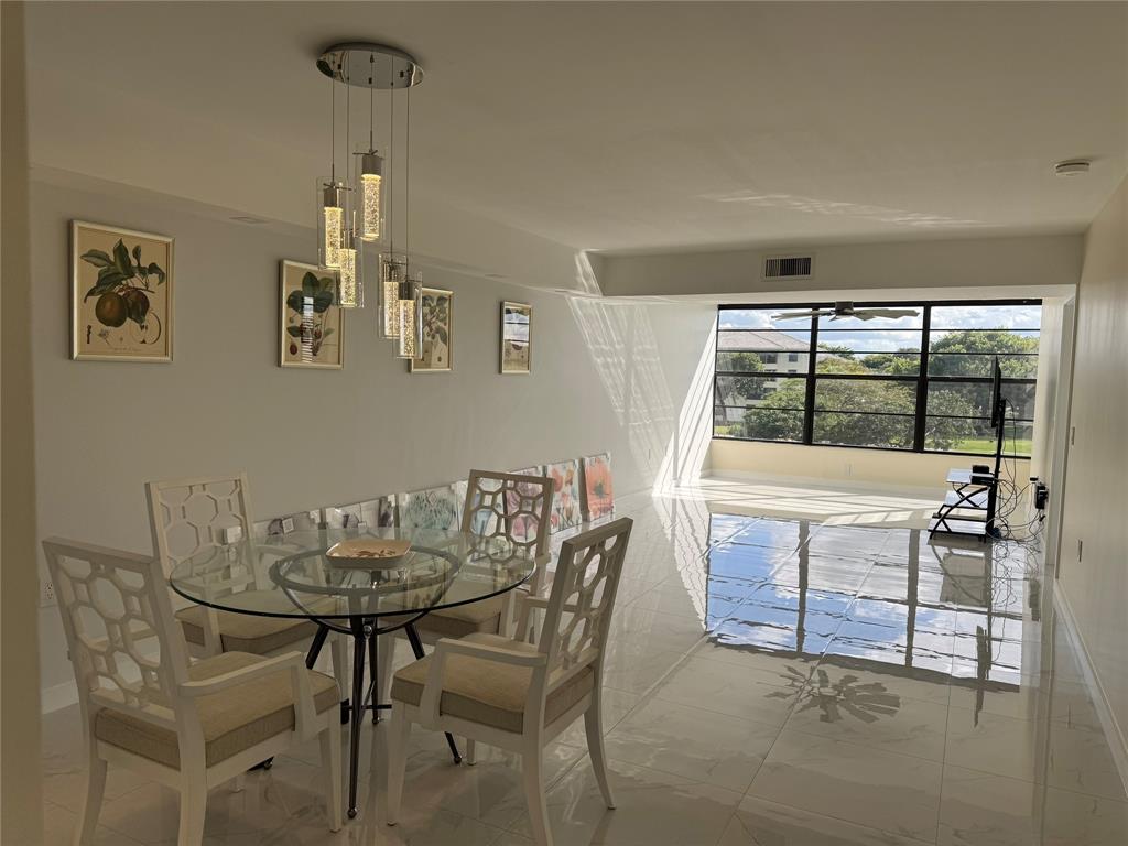 1520 Whitehall Drive, Unit 306 Davie, FL 33324 - Photo 2 of 42 a view of a dining room with furniture window and outside view