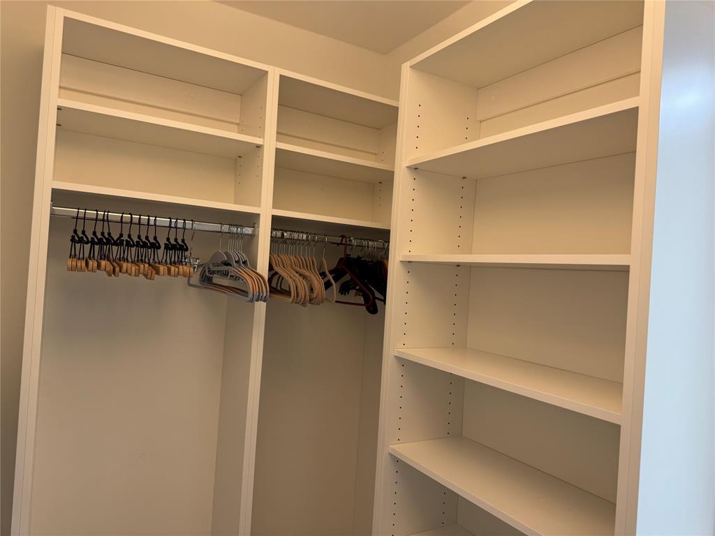 1520 Whitehall Drive, Unit 306 Davie, FL 33324 - Photo 25 of 42 a view of walk in closet with empty racks