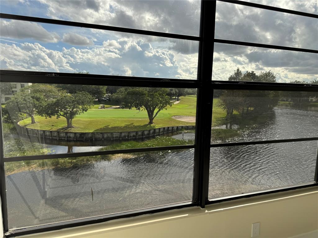 1520 Whitehall Drive, Unit 306 Davie, FL 33324 - Photo 27 of 42 a view of a lake from a window