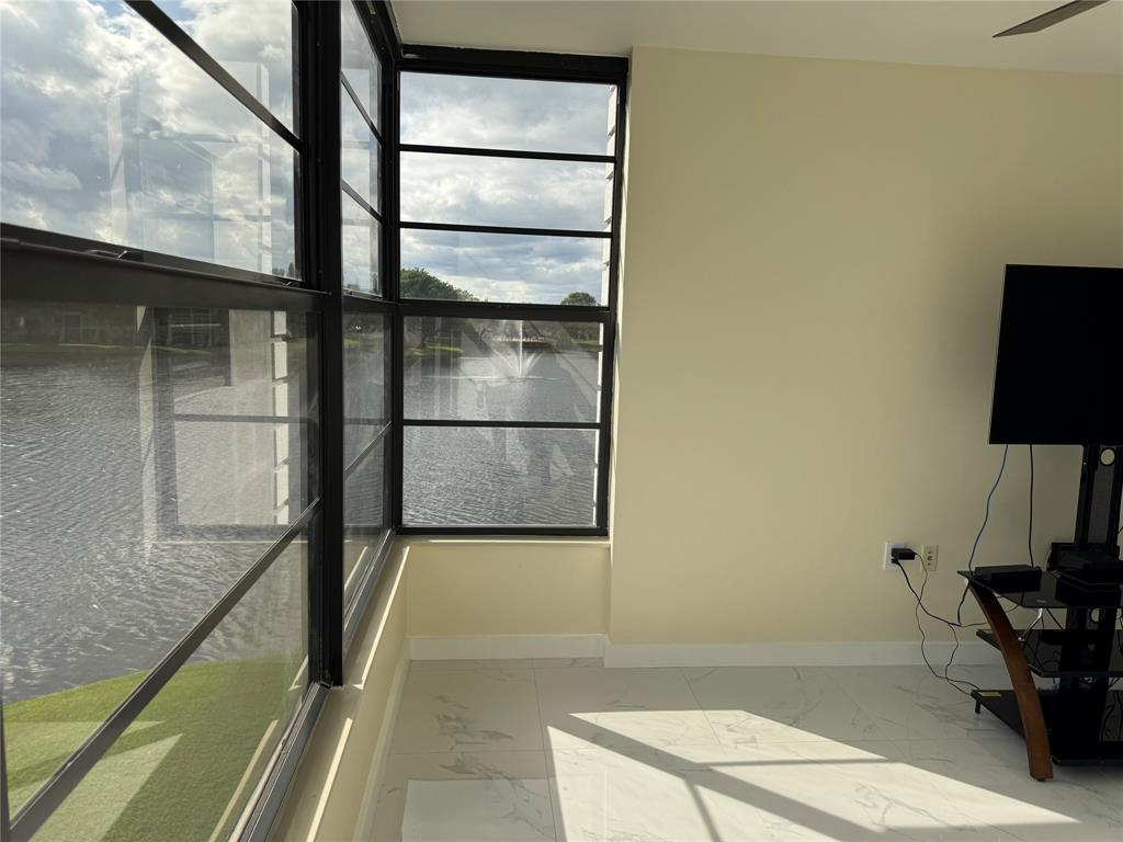 1520 Whitehall Drive, Unit 306 Davie, FL 33324 - Photo 30 of 42 a view of staircase with a rug