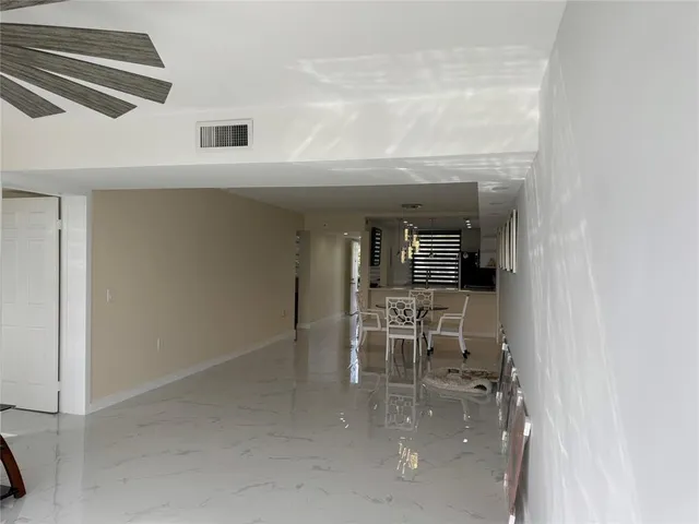 a view of dining room with furniture and a window