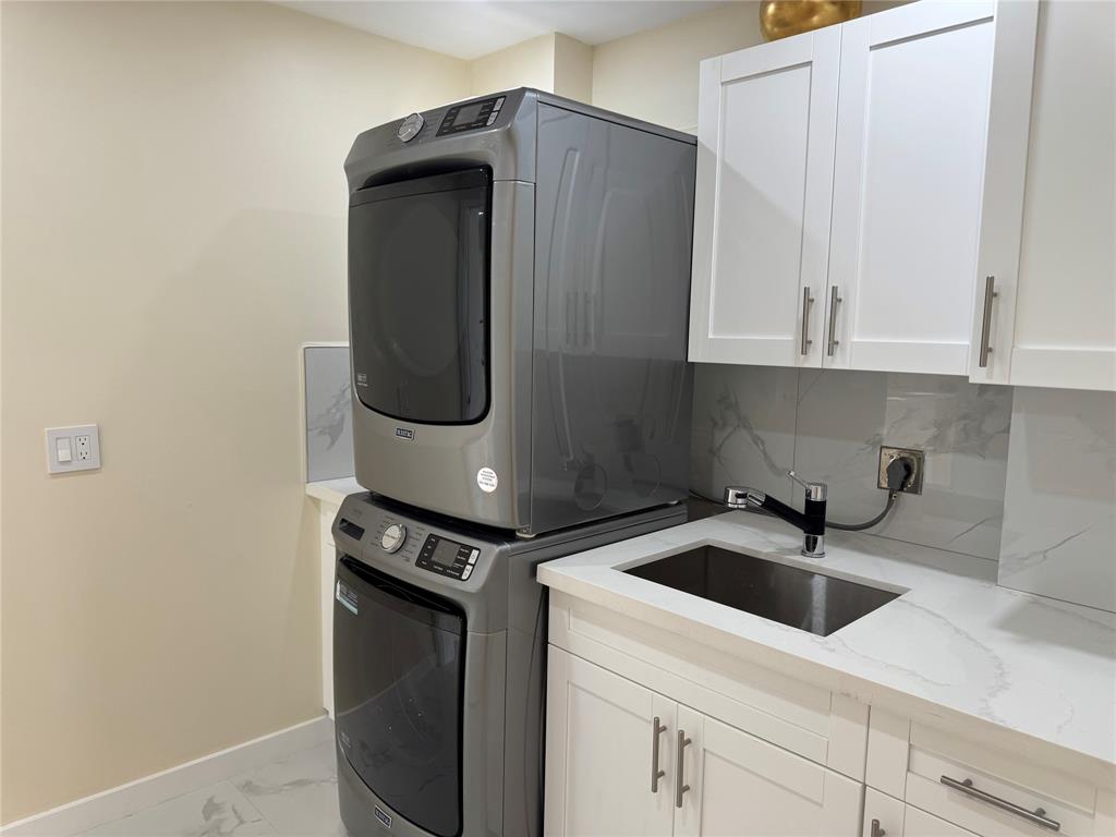 1520 Whitehall Drive, Unit 306 Davie, FL 33324 - Photo 34 of 42 a kitchen with a white cabinets and white sink