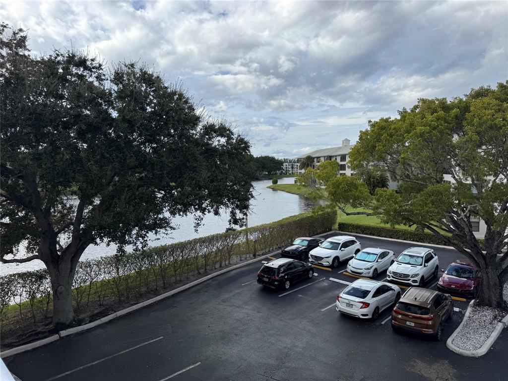 1520 Whitehall Drive, Unit 306 Davie, FL 33324 - Photo 37 of 42 a view of a street with cars parked