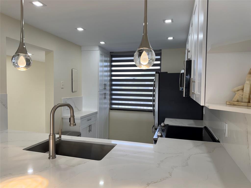 1520 Whitehall Drive, Unit 306 Davie, FL 33324 - Photo 6 of 42 a view of a lobby area with wooden floor