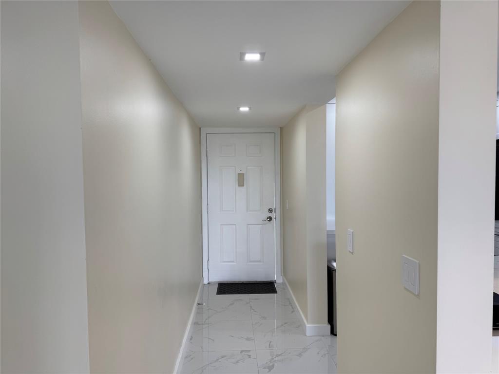 1520 Whitehall Drive, Unit 306 Davie, FL 33324 - Photo 7 of 42 a view of a hallway