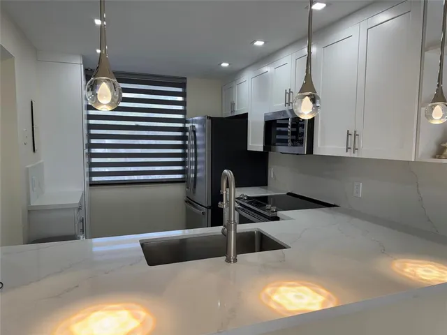 a view of kitchen and utility room