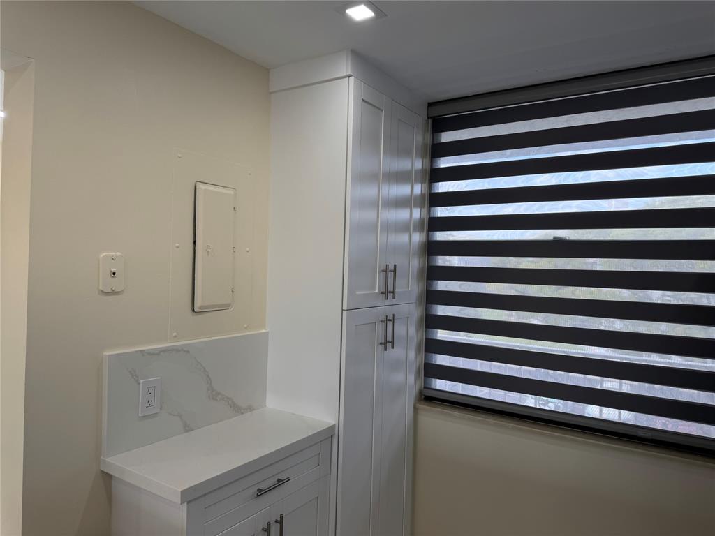 1520 Whitehall Drive, Unit 306 Davie, FL 33324 - Photo 10 of 42 a view of kitchen and utility room