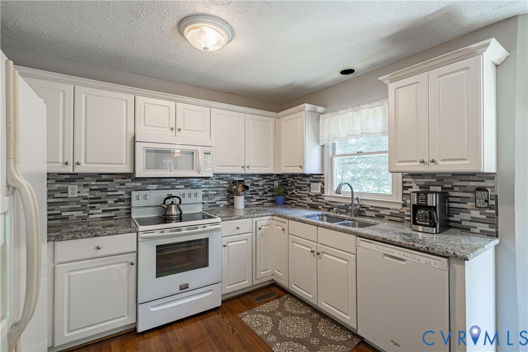 4501 Foxwood Road Chester, VA 23831 - Photo 10 of 42 Kitchen featuring white cabinetry, granite counter