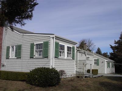 10 George Street Barnstable, MA 02630 - Photo 8 of 11 a view of a house with a yard