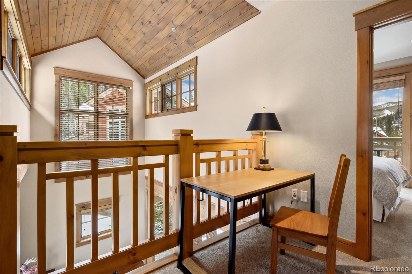 129 Tip Top Trail, Unit 6543 Dillon, CO 80435 - Photo 13 of 40 a view of a dining room with furniture window and wooden floor