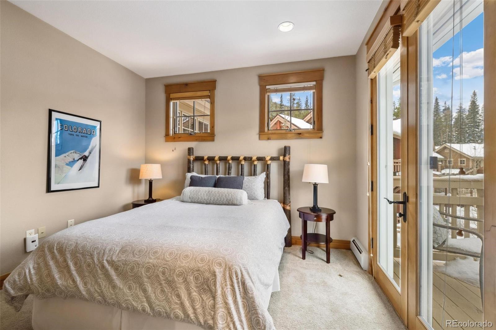 129 Tip Top Trail, Unit 6543 Dillon, CO 80435 - Photo 20 of 40 a bedroom with a bed and a painting on the wall