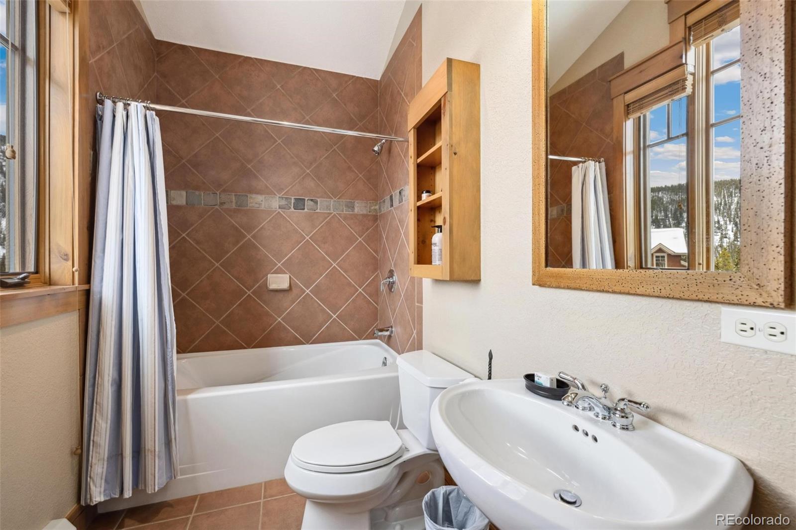 129 Tip Top Trail, Unit 6543 Dillon, CO 80435 - Photo 21 of 40 a bathroom with a sink toilet and shower