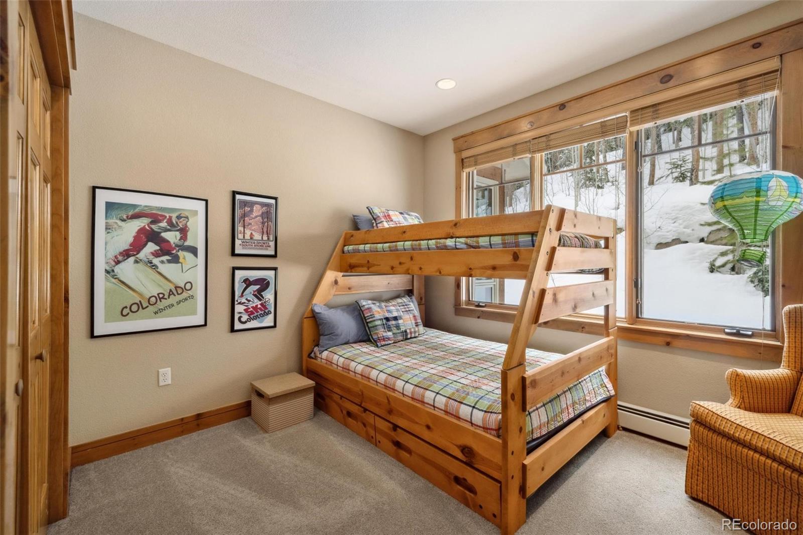 129 Tip Top Trail, Unit 6543 Dillon, CO 80435 - Photo 24 of 40 a bedroom with a bed and glass window