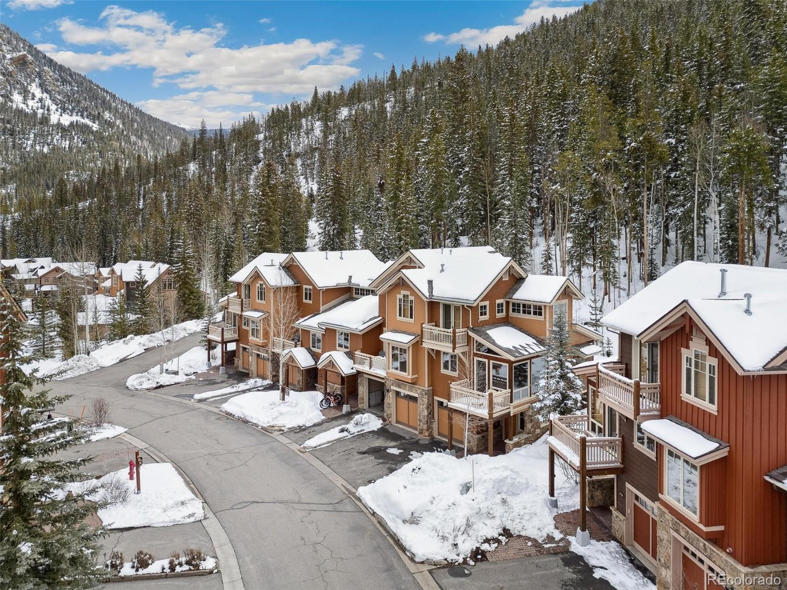 129 Tip Top Trail, Unit 6543 Dillon, CO 80435 - Photo 29 of 40 a view of a building with a yard