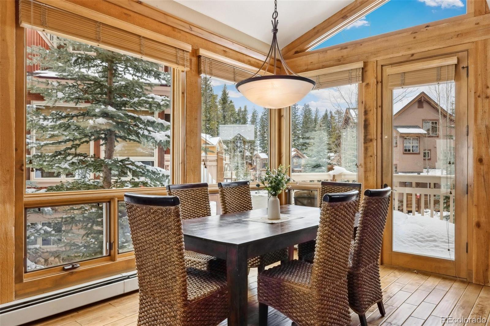 129 Tip Top Trail, Unit 6543 Dillon, CO 80435 - Photo 8 of 40 a view of a dining room with furniture window and wooden floor